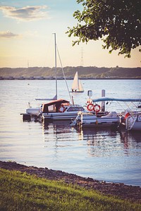 Sailboats tied at a pier. Visit Kaboompics for more free images.