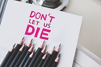 Close up of paper with the phrase &quot;Don&#39;t let us die&quot;. Visit <a href="https://kaboompics.com/" target="_blank">Kaboompics</a> for more free images.