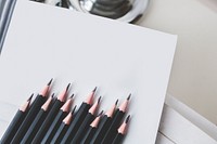Flat lay of pencils on blank paper. Visit <a href="https://kaboompics.com/" target="_blank">Kaboompics</a> for more free images.