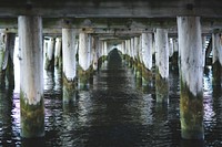 Water under a pier. Visit <a href="https://kaboompics.com/" target="_blank">Kaboompics</a> for more free images.