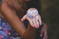 Woman holding a crystal ball. Visit <a href="https://kaboompics.com/" target="_blank">Kaboompics</a> for more free images.