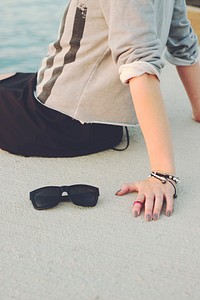 Close up of a woman sitting down. Visit Kaboompics for more free images.