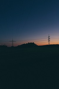 Silhouette of electrical towers