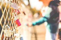 Closeup of love locks on a fence