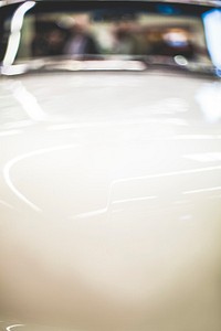 Close up of a white car hood