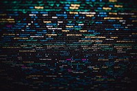 Software developer programming code on black background