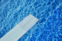 Spring board over a swimming pool
