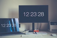 Computer screens showing the time
