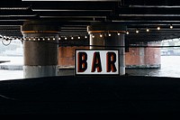 Floating bar under a bridge