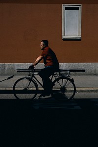 Man riding a bicycle down the street