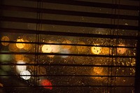 Bokeh yellow lights outside the window