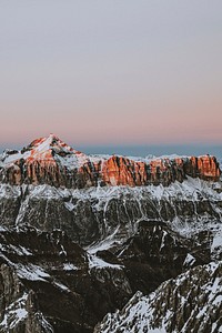 Pink sky over a summit in the Dolomites, Italy