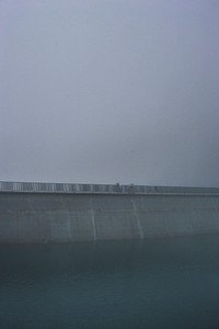 Railing by a foggy dam