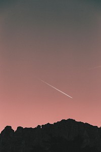 Plane leaving contrails in the sky