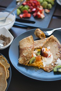 Oat crepes with yogurt and fruits food photography