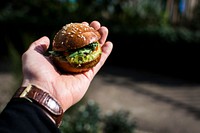 Mini guacamole burger on hand