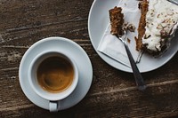 Aerial view of a coffee cup and a piece of cake food photography