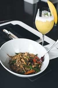 Thai noodle serving with mango smoothie
