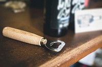 A bottle opener on a wooden counter