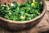 Chopped kale in wooden bowl