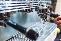 Barista operating a coffee machine