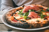 Homemade pizza with prosciutto crudo food photography