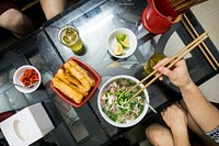 Eating Pho, a Vietnamese noodle soup