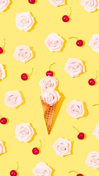 Flowers in a waffle cone topped a with red cherry