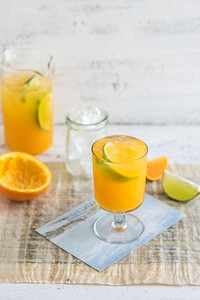 Fresh orange juice with lime and ice. Visit <a href="https://monikagrabkowska.com/" target="_blank">Monika Grabkowska</a> to see more of her food photography.