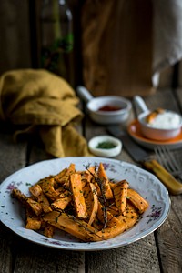 Sweet potato baked with herbs. Visit <a href="https://monikagrabkowska.com/" target="_blank">Monika Grabkowska</a> to see more of her food photography.