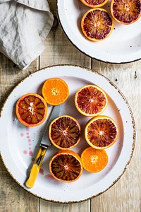 Plate of fresh blood oranges. Visit <a href="https://monikagrabkowska.com/" target="_blank">Monika Grabkowska</a> to see more of her food photography.