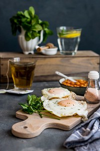 Sunny side up fried eggs and baked beans. Visit <a href="https://monikagrabkowska.com/" target="_blank">Monika Grabkowska</a> to see more of her food photography.