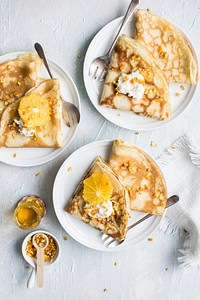 French pancakes with cream and almonds. Visit Monika Grabkowska to see more of her food photography.