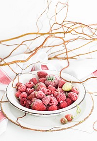 Bowl of frozen strawberries and raspberries. Visit <a href="https://monikagrabkowska.com/" target="_blank">Monika Grabkowska</a> to see more of her food photography.