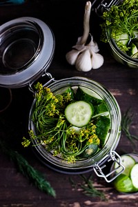 Jar of homemade pickles in dill. Visit <a href="https://monikagrabkowska.com/" target="_blank">Monika Grabkowska</a> to see more of her food photography.