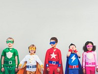 Smiling diverse children in superhero costumes