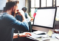 Casual man working on a computer in an office