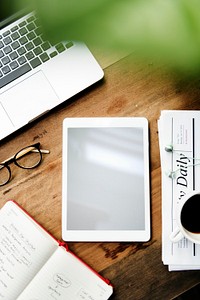 Flatlay of a workspace and an empty screen tablet