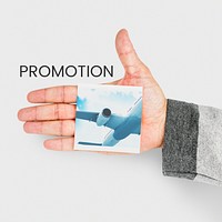 hand holding banner with illustration of air ticket booking for travel destination