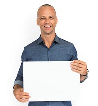 Smiling guy holding a blank placard