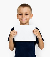 Young boy holding a blank paper