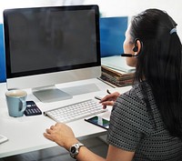 Woman in the office and an empty computer screen