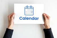 Hands holding banner with illustration of personal organizer calendar