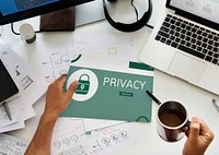 Hand holding banner with illustration of computer security system