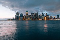 View from the water of New York City's well-lit skyline, free public domain CC0 image.