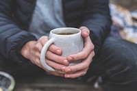 Free hands holding a cup of coffee photo, public domain drink CC0 image.