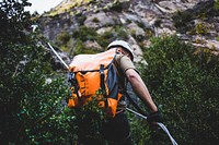 Free man hiking up a mountain image, public domain adventure CC0 photo.