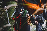 Close up of multiple carabiners on a climbers backpack.