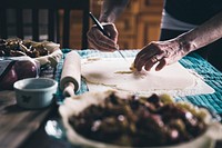 Woman cutting dough, free public domain CC0 photo.