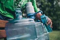 Filling bottle with water, free public domain CC0 photo